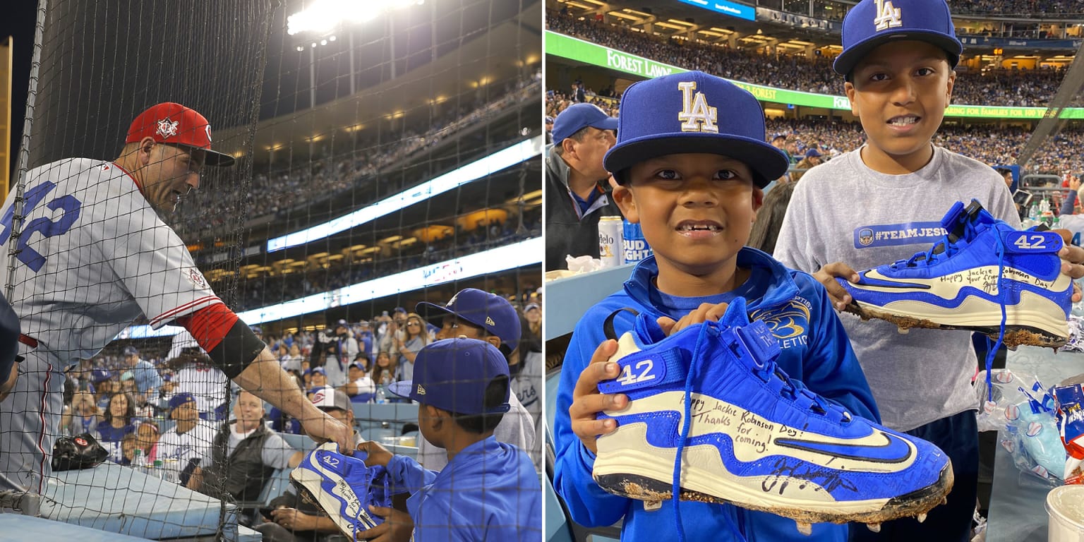 Joey Votto gives Jackie Robinson Day cleats to Reds-Dodgers game fan