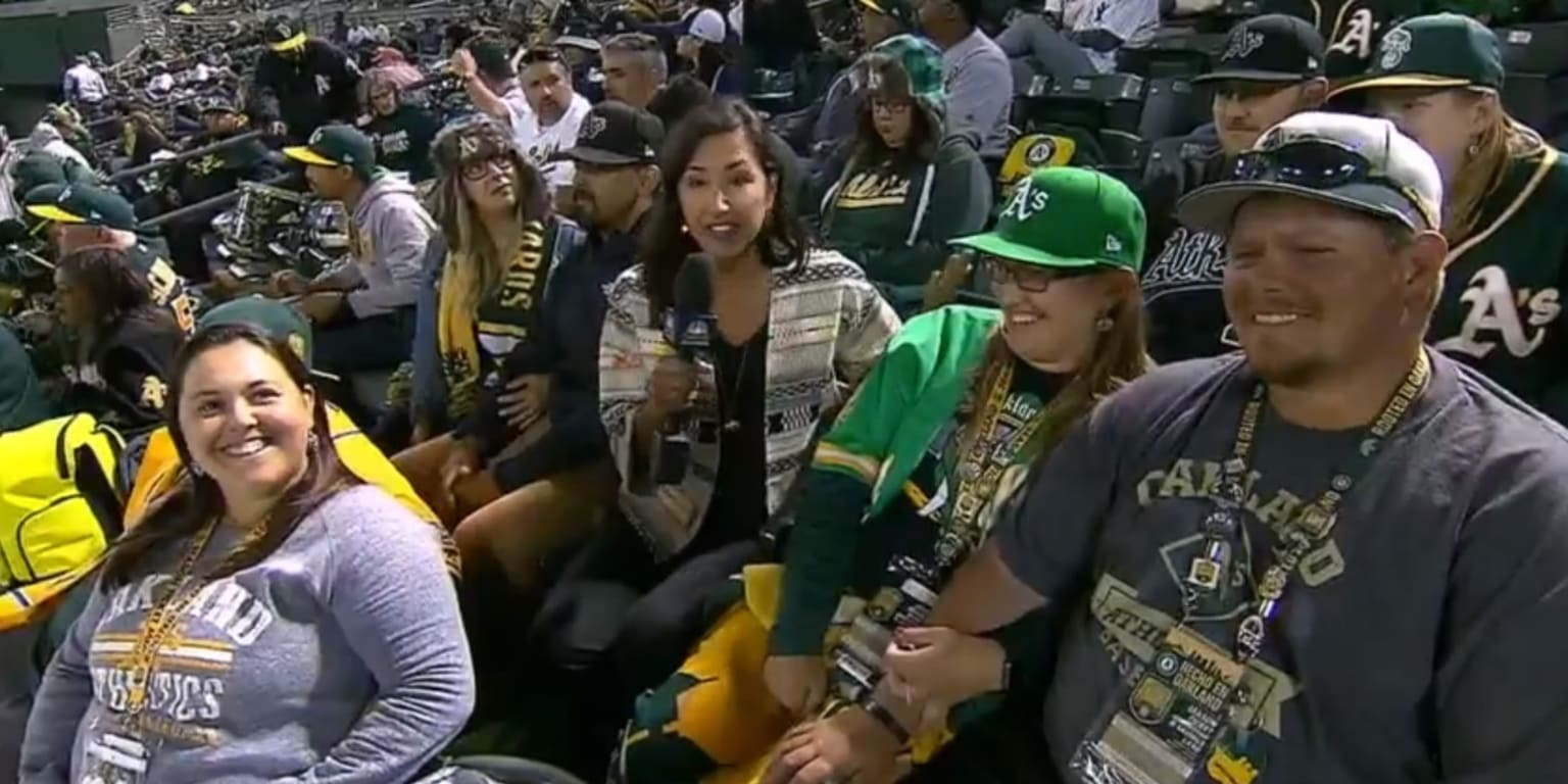 Four A's fan couples with wedding plans sat next to each other at the  Oakland Coliseum