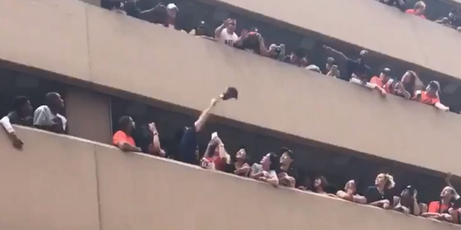 Astros fans team up in epic game of catch to return dropped hat at