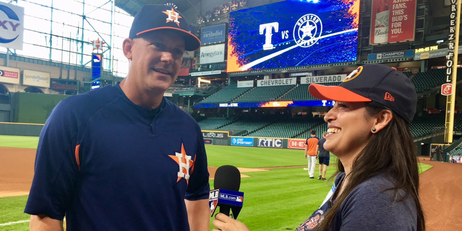 Astros fan Minerva Romero claims auction prize