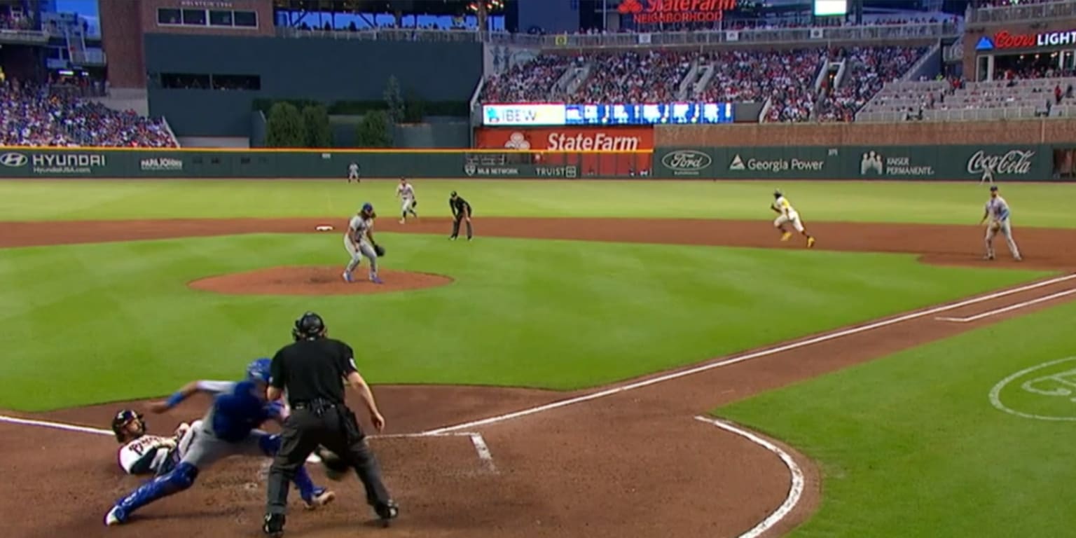 Talk about a WILD pitch! Ball goes off wall, between ump's legs