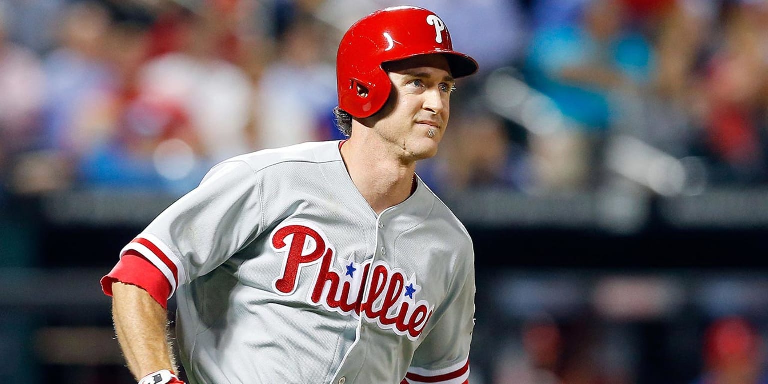 Chase Utley of the Philadelphia Phillies watches from the dugout