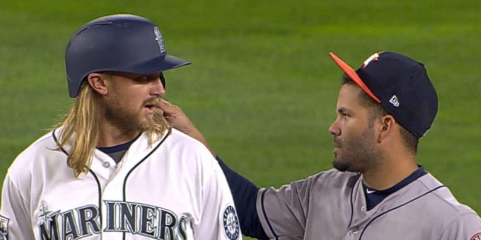 Jose Altuve couldn't resist the appeal of Taylor Motter's long blond locks  and just had to get a feel