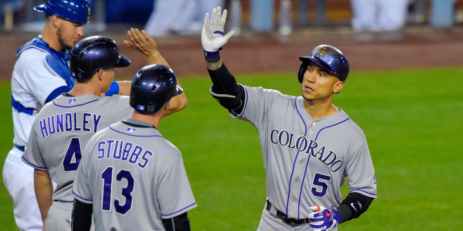 Carlos Gonzalez of the Colorado Rockies leads off second base