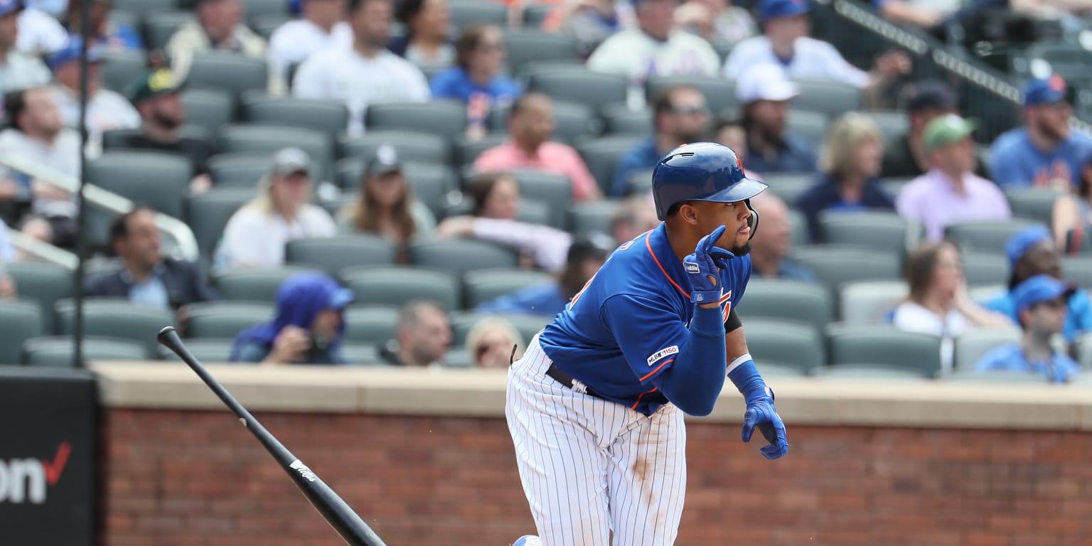 New York Mets' Wilson Ramos celebrates with Carlos Gomez (91