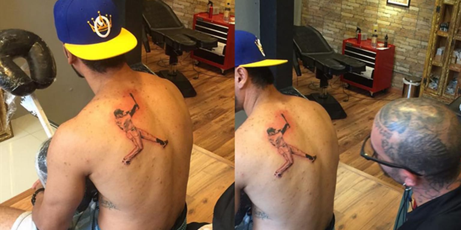 A Major League Baseball tattoo is seen on the neck of Chicago Cubs