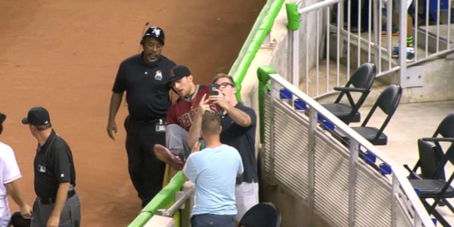 Fan snaps a selfie with Brandon Drury after the outfielder makes