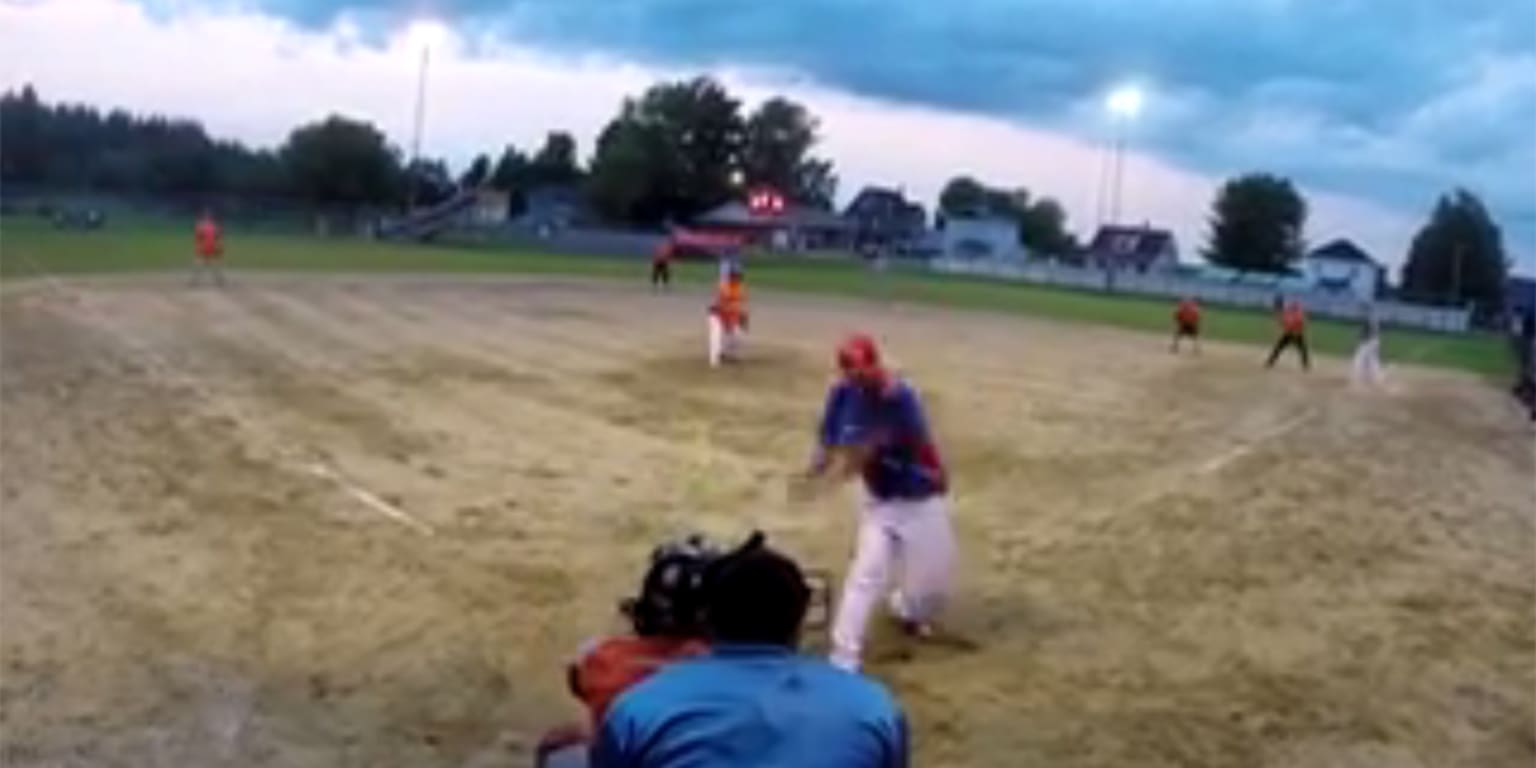 Softball player hits dinger on behindtheback