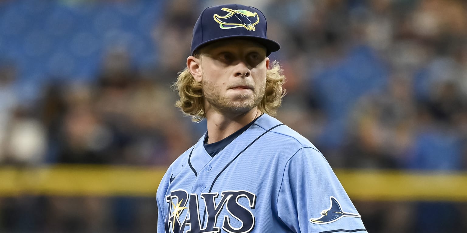 Tampa Bay Rays pitching coach Kyle Snyder, left, looks on as Shane