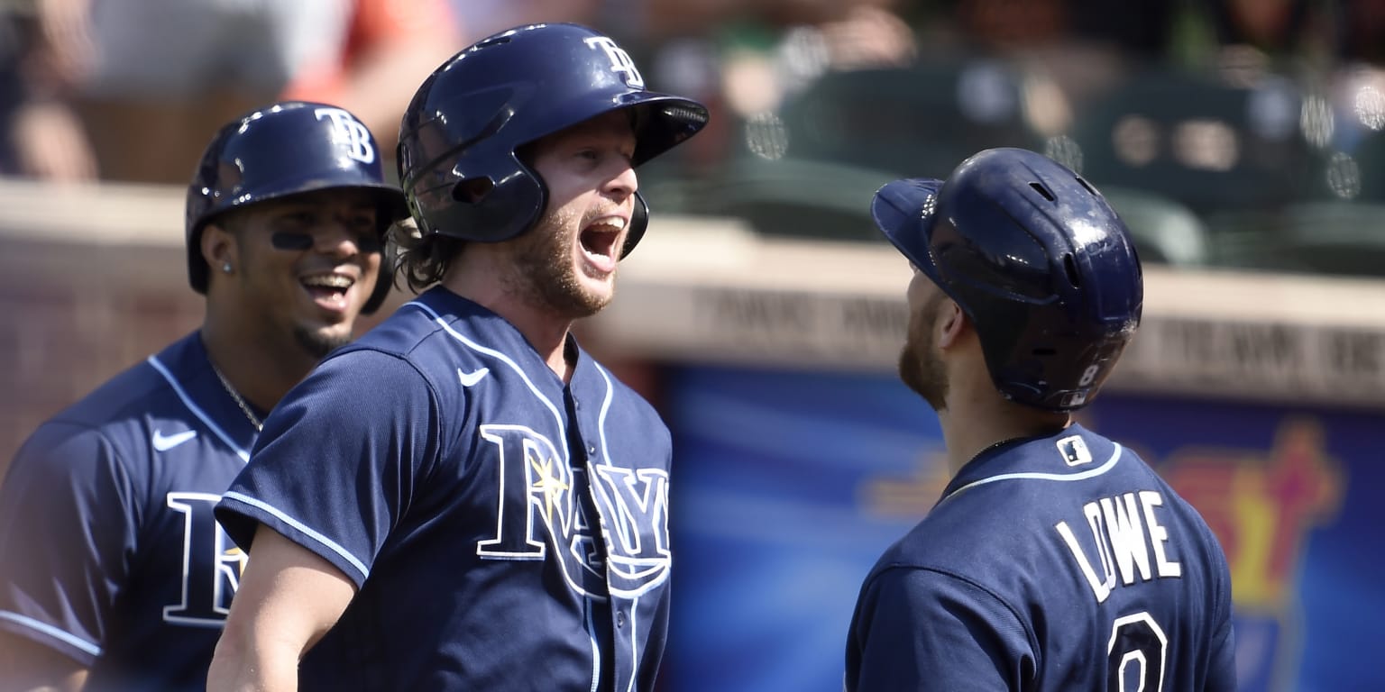 Tampa Bay Rays' Brett Phillips is greeted in the dugout after