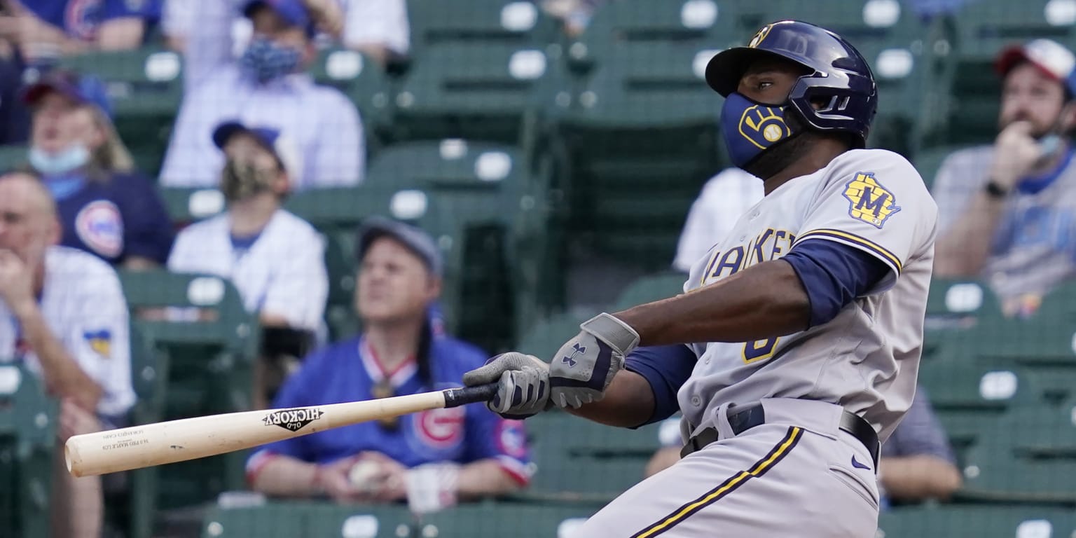Lorenzo Cain crushes a home run while masked during one of the few games he played in 2020.