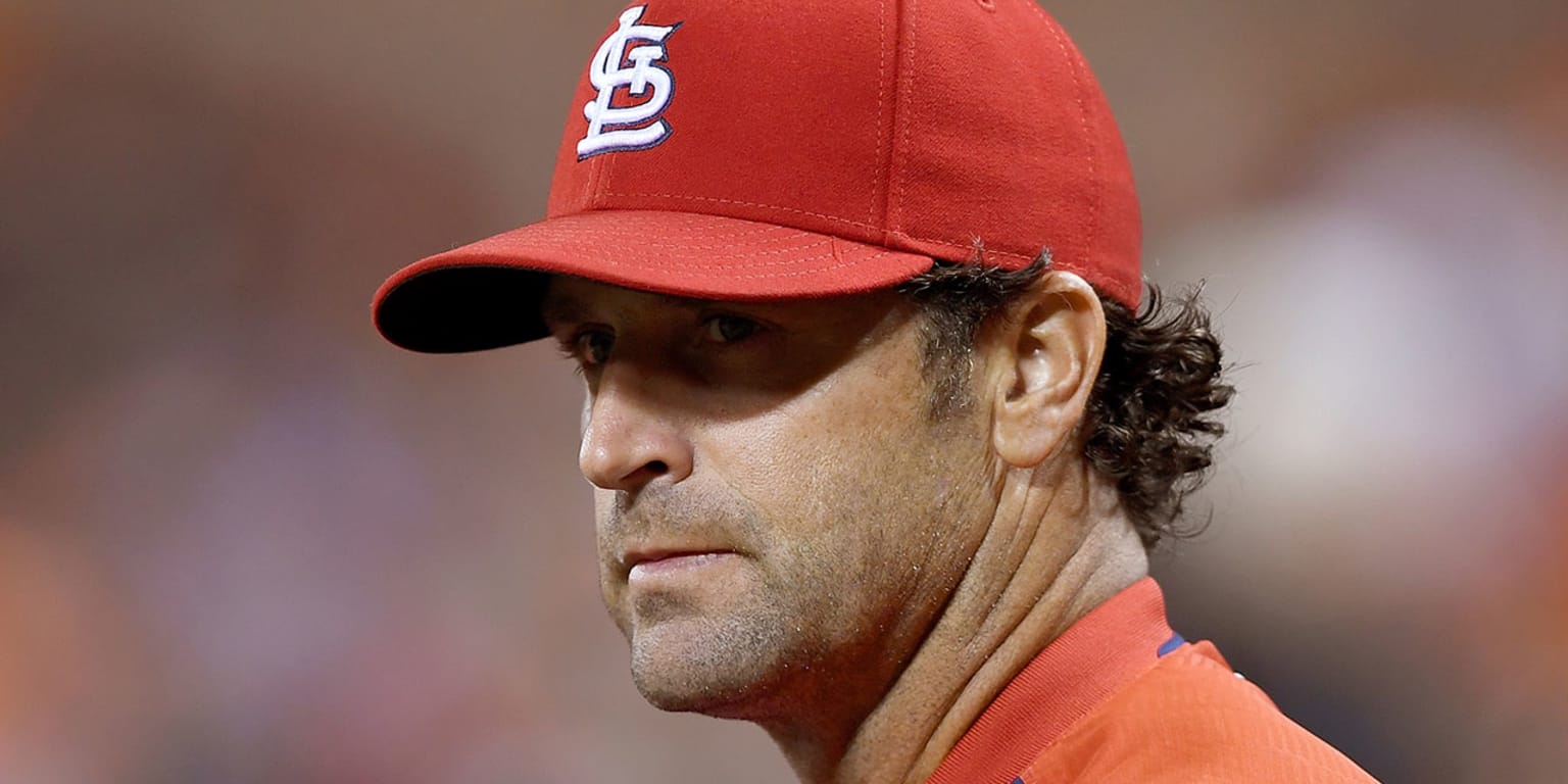 St. Louis Cardinals manager Mike Matheny throws batting practice