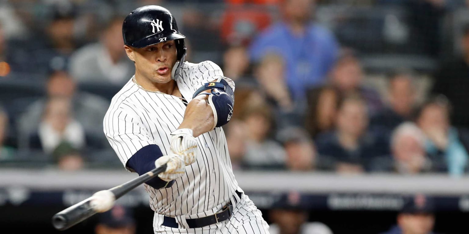 BRONX, NY - SEPTEMBER 05: New York Yankees designated hitter Giancarlo  Stanton (27) rounds the bases after hitting a two run home run during the  sixth inning of the Major League Baseball