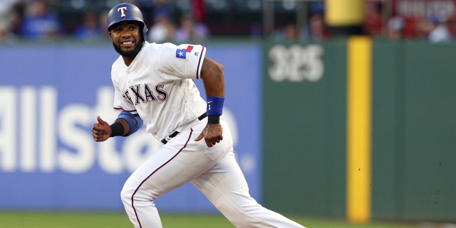 Texas Rangers' Elvis Andrus smiles as he looks on at play during a