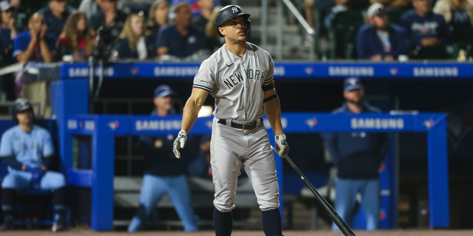 New York Yankees Giancarlo Stanton heads to the dugout after batting  against the Atlanta Braves during a spring training game at Champion  Stadium in Kissimmee, Florida on March 18, 2019. Photo by