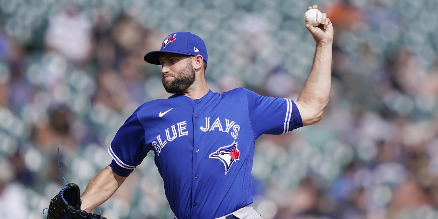 Toronto Blue Jays' Adam Cimber follows through on his delivery to