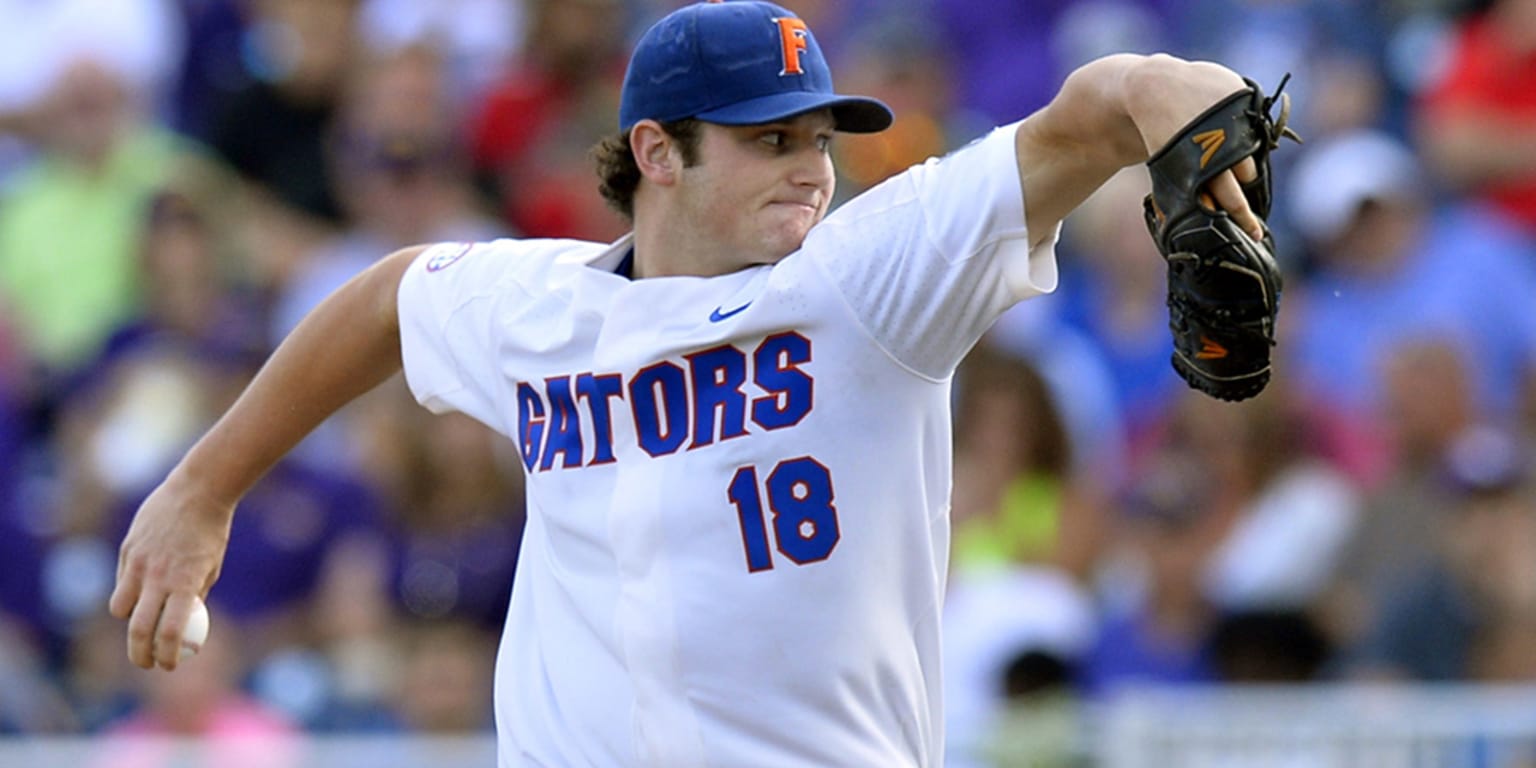 Florida pitcher Brady Singer works against Louisville during the