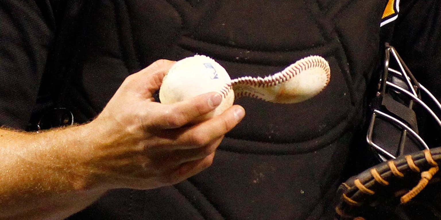 Brewers catcher Martin Maldonado knocks the cover off a baseball 