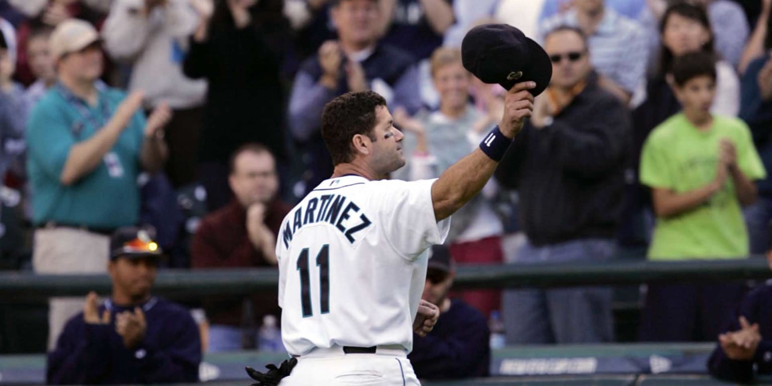 FILE - In this April 1, 2002, file photo, Seattle Mariners' Edgar Martinez  tips his cap to the crowd as he is introduced for the baseball team's  season opener against the Chicago