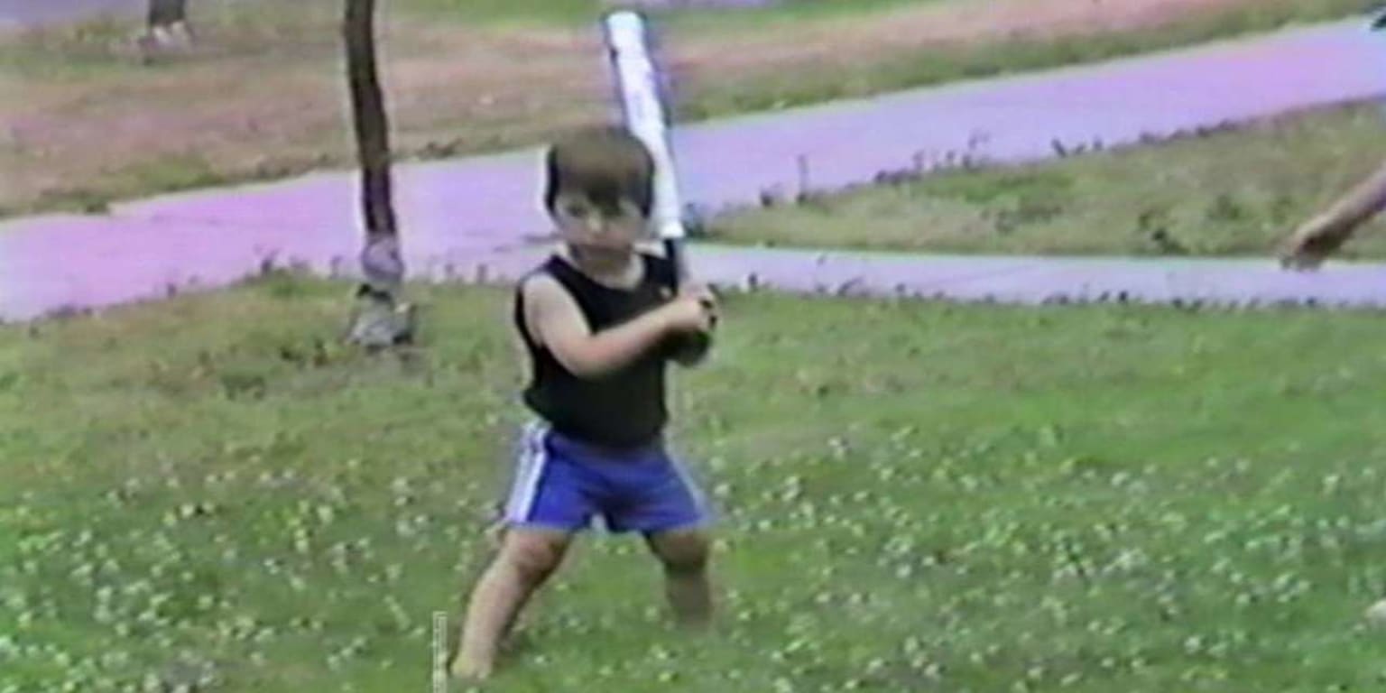 Gather round and watch an adorable home video of toddler Joe Mauer playing  baseball