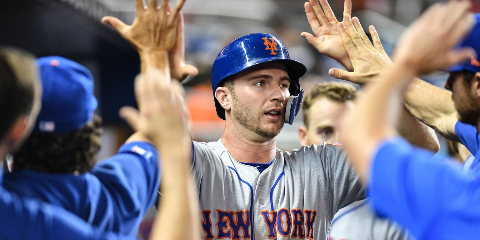 Alonso wears catcher's gear in the dugout 