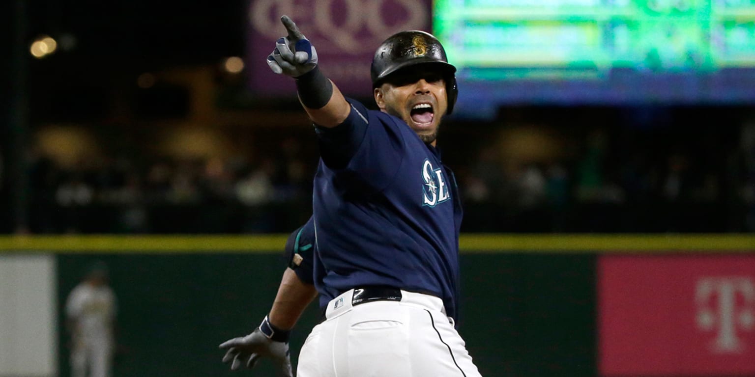 Seattle Mariners' Franklin Gutierrez runs the bases after hitting a  three-run home run off Cincinnati Reds starting pitcher John Lamb, right,  in the fourth inning of a baseball game, Saturday, May 21