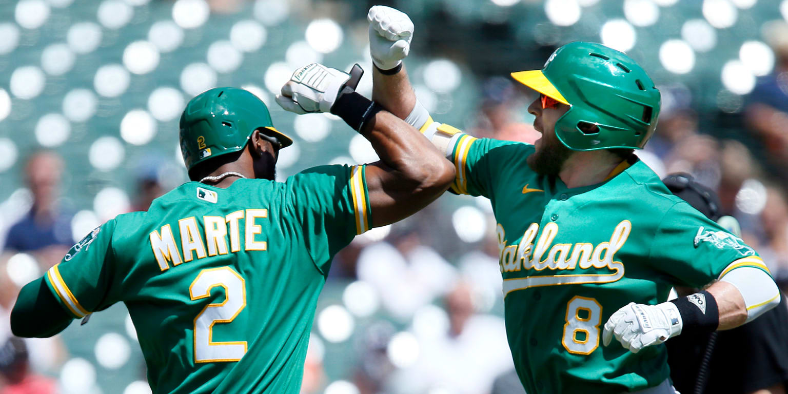 A's ride early outburst to hold off Tigers