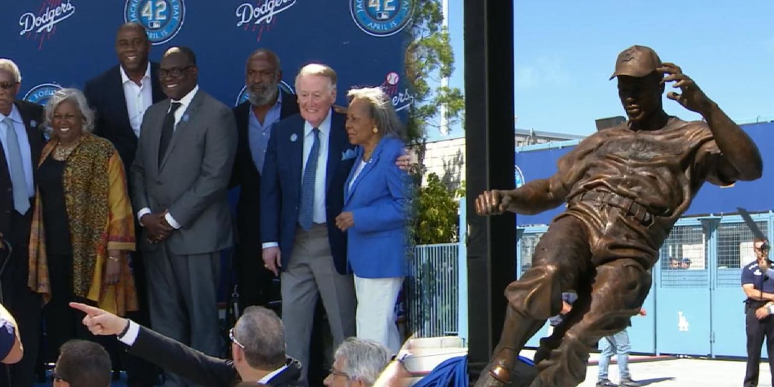 Los Angeles Dodgers gather at Jackie Robinson statue to pay respects 