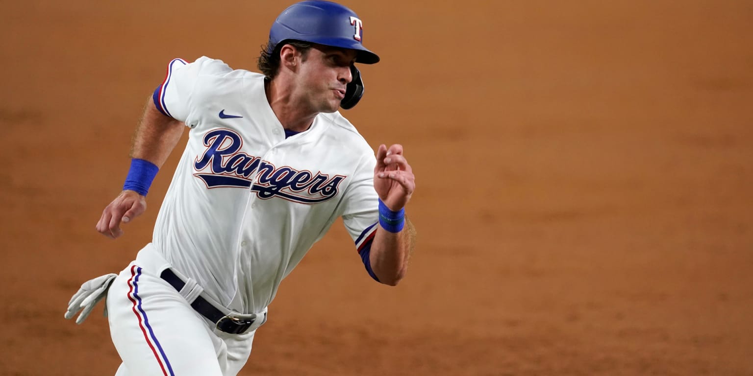 Texas Rangers designated hitter DJ Peters (38) reacts after flying