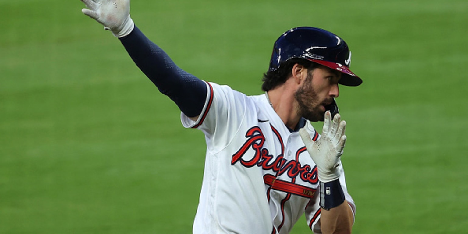 Dansby Swanson of the Braves trots off the field and back to the