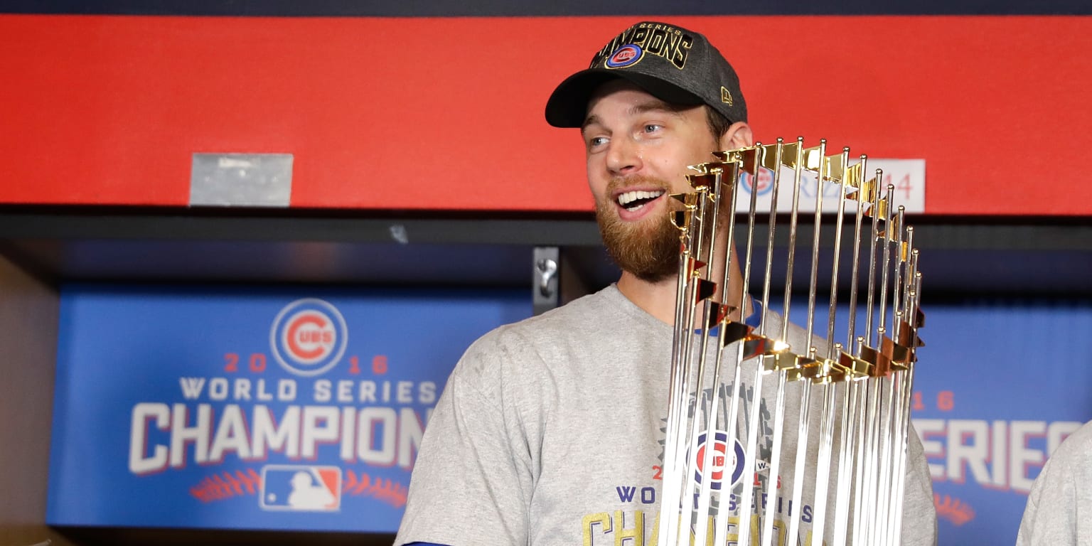 Chicago Cubs outfielder BEN ZOBRIST holds up his MVP trophy