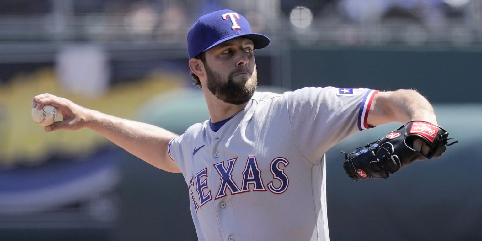 Texas Rangers catcher Jose Trevino, left, and relief pitcher Ian