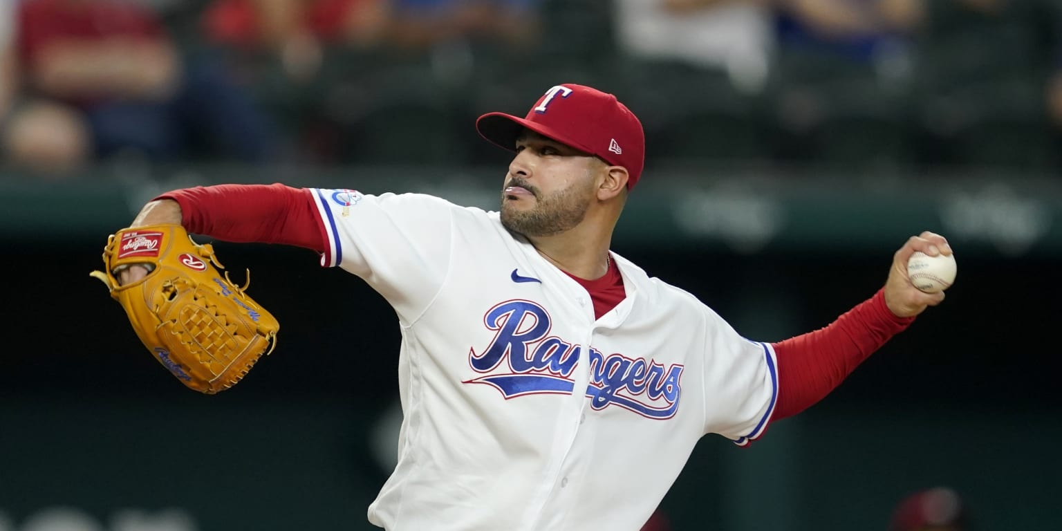 Texas Rangers starting pitcher Martin Perez throws during the