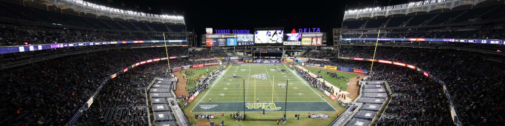 Fans go through metal detectors at Yankee Stadium