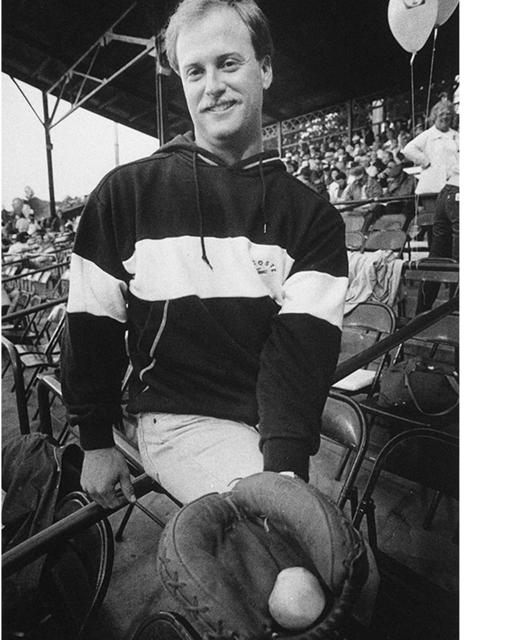 Bresnahan grinning with a potato in his mitt