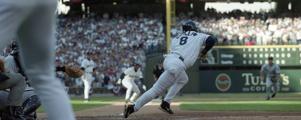 Seattle Mariners' Randy Wynn watches his grand slam home run off