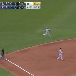 Chicago White Sox's Jimmy Rollins, front, throws his bat after