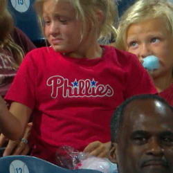 Teenage fan gives foul ball to young child 