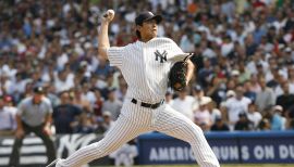 L-R) Former baseball pitcher Chien-Ming Wang, Sons J.J. Wang and