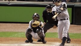 Joe Crede of the Minnesota Twins helps his daughter Lucy Crede bat