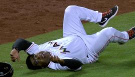 Florida Marlins' Juan Pierre scores on a Damion Easley base hit as