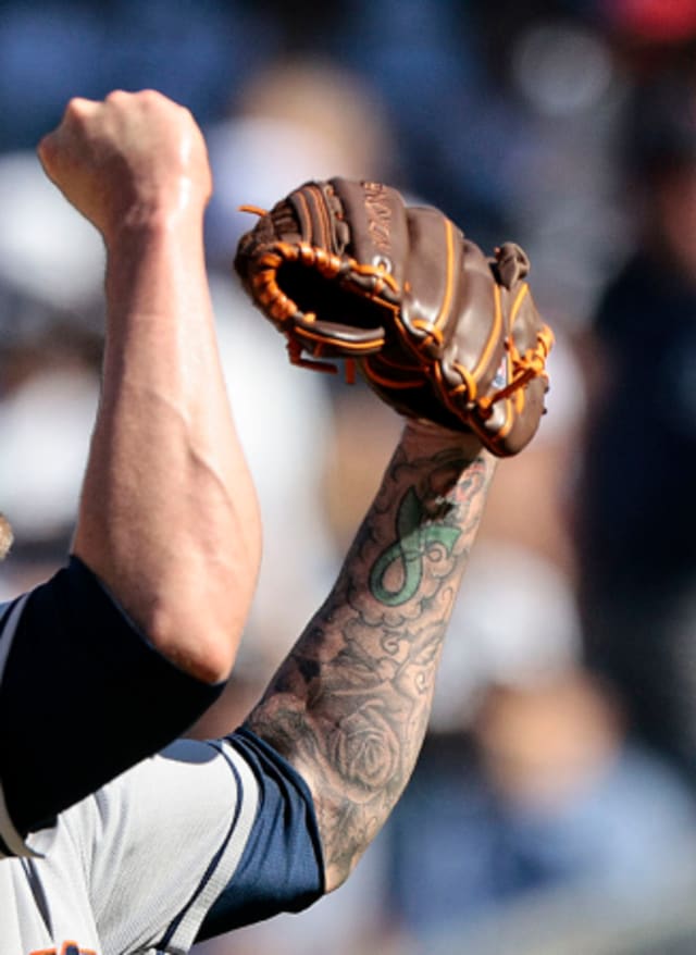 A tattoo is seen on the arm of St. Louis Cardinals' Tyler O'Neill as he  watches from the dugout during the sixth inning of a baseball game against  the San Diego Padres