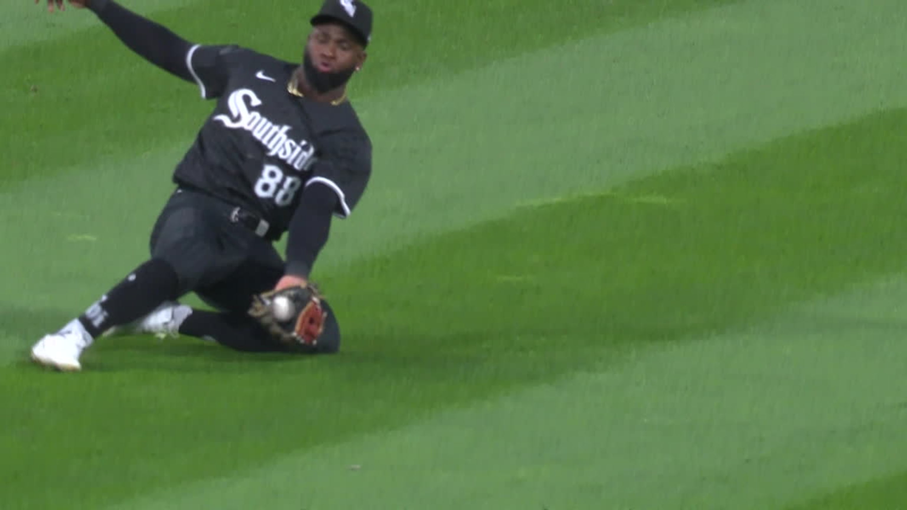 Luis Robert Jr. makes a second sliding grab