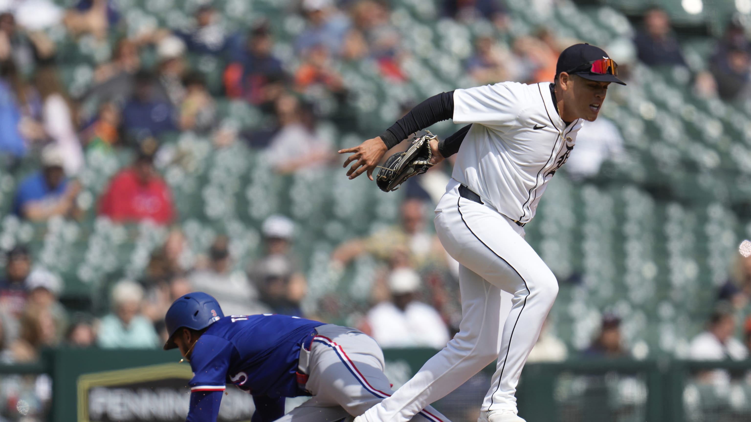 Leody Taveras ducks under the tag