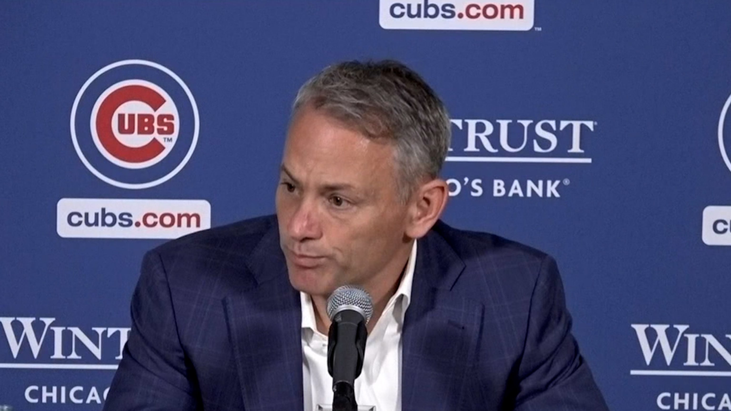 President Jed Hoyer of the Chicago Cubs presents a jersey to