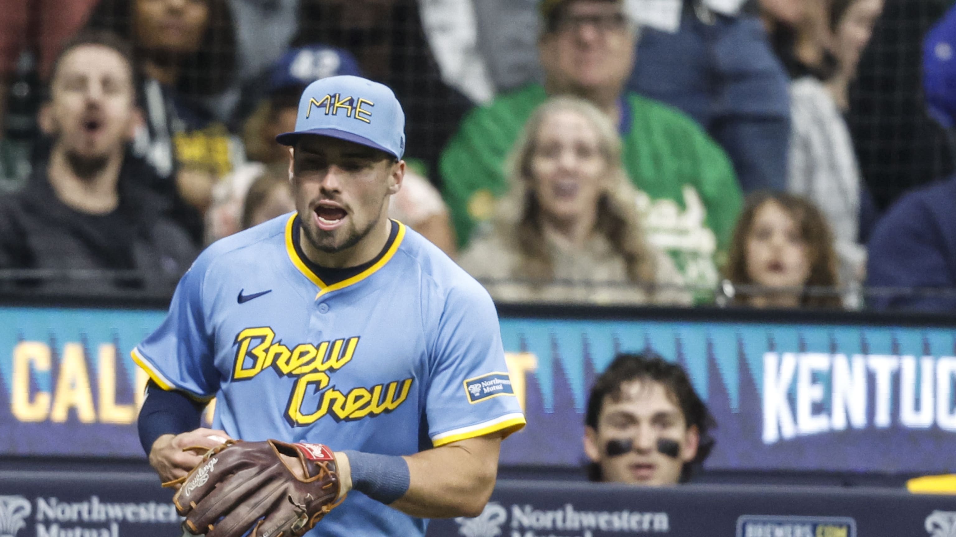 Caleb Durbin makes a catch over the railing