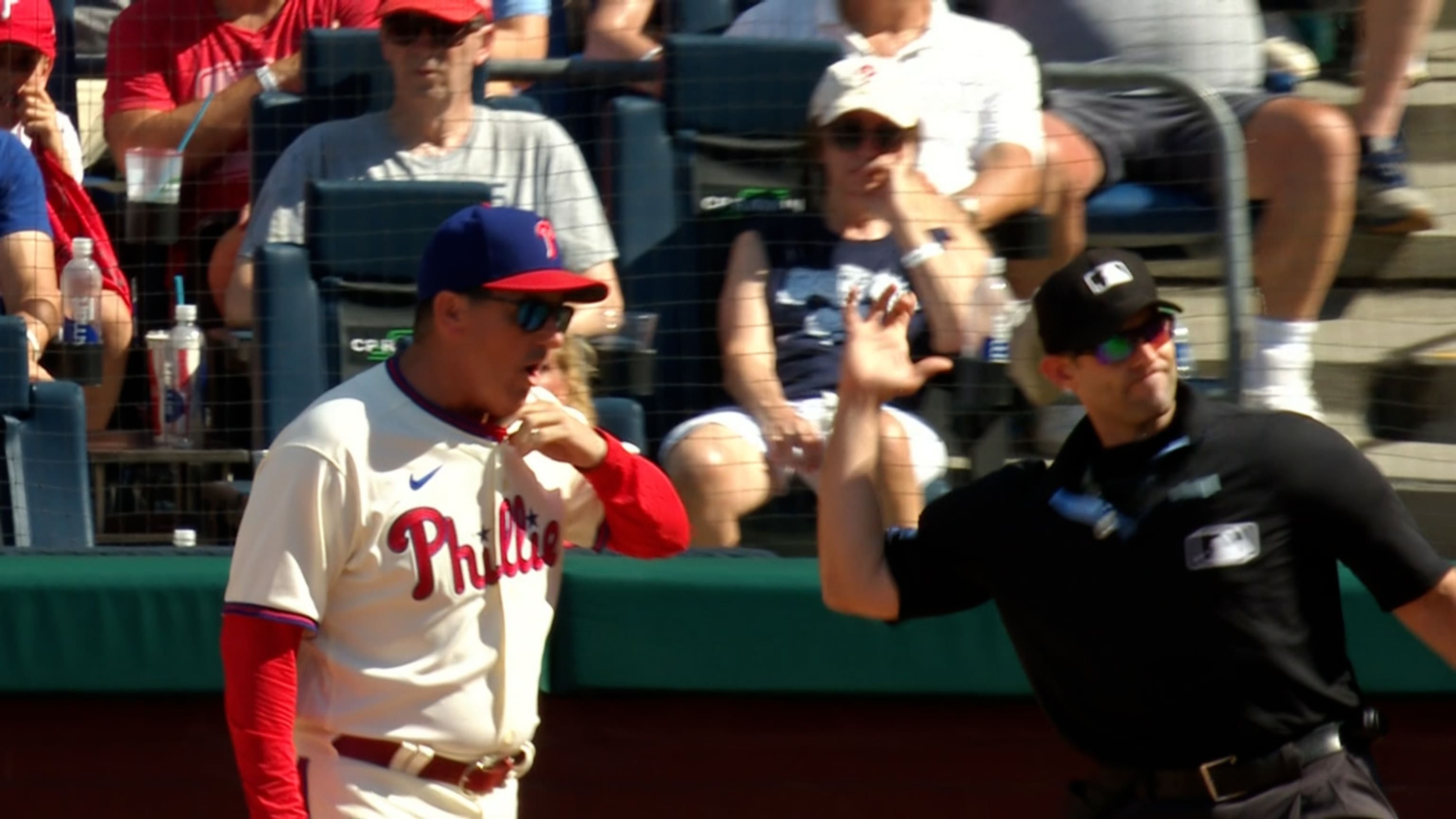 Philadelphia Phillies - Alec Bohm smiling, while putting on his