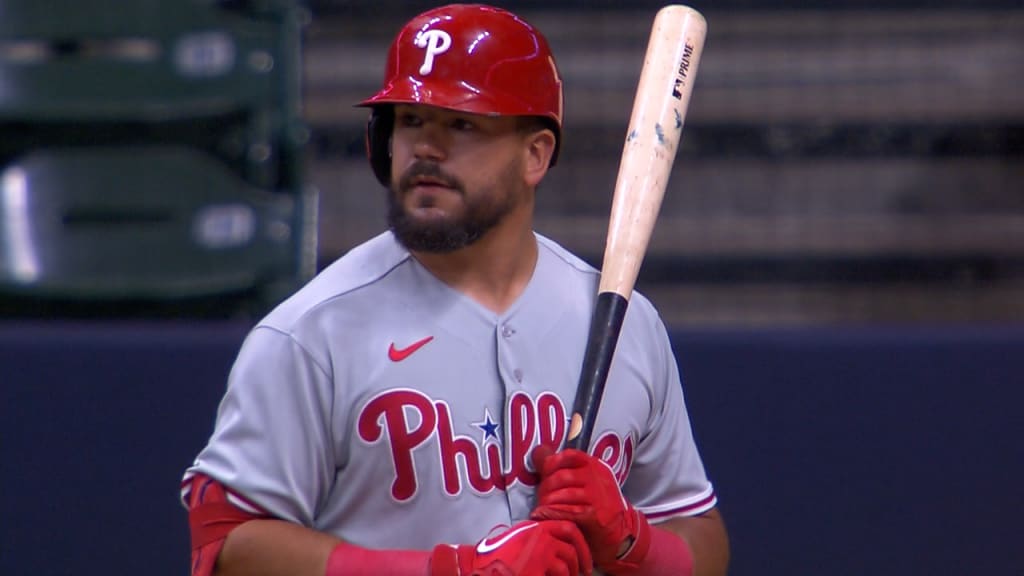 Chicago Cubs' Kyle Schwarber watches his RBI triple off Cincinnati