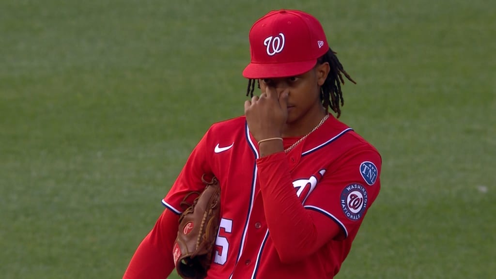 CJ Abrams of the Washington Nationals throws the ball to first