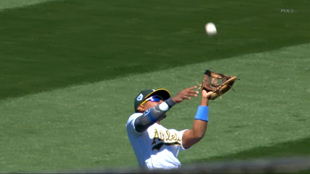 Tony Kemp of the Oakland Athletics reacts to field a ground ball